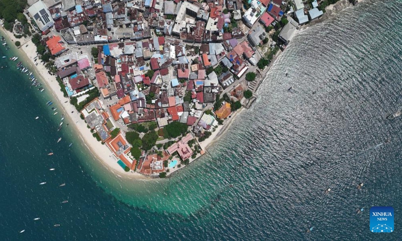 An aerial drone photo taken on Dec. 11, 2024 shows a view of the Stone Town in Zanzibar, Tanzania. Stone Town, designated as a World Heritage Site by the United Nations Educational, Scientific and Cultural Organization in 2000, is a prime example of the Swahili coastal trading towns of East Africa. It retains its urban fabric and townscape largely intact, with many fine buildings reflecting a unique culture that blends African, Arabian, Indian, and European influences accumulated over more than a millennium. (Xinhua/Han Xu)