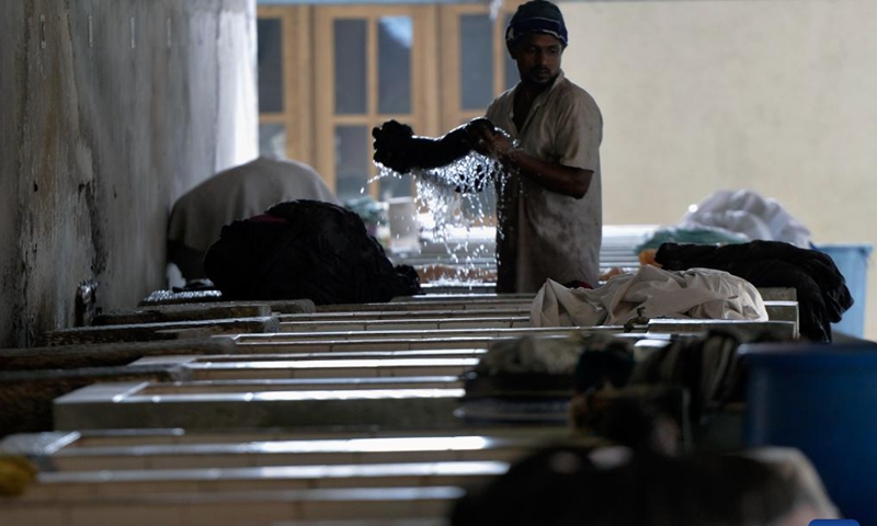 A laundry worker works at a community named Laundrywatte in Colombo, Sri Lanka on Dec. 13, 2024. (Photo: Xinhua)