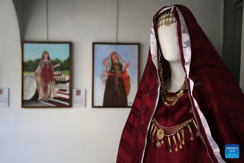 A traditional women's attire is displayed during an exhibition in Medea, Algeria, Dec. 12, 2024. (Photo: Xinhua)