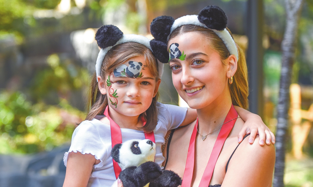 Visitors celebrate the arrival of giant pandas with panda face paintings at the San Diego Zoo on August 7, 2024, in San Diego, California. Photo: VCG