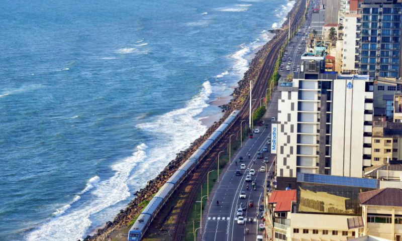 This photo taken on Dec. 23, 2024 shows a train by the sea in Colombo, Sri Lanka.
The coastal railway line, located on the west coast of Sri Lanka and close to the Indian Ocean, is a major railway line in this island country. It is also a famous tourist attraction, where the straight coastline, the carriages without doors, and the beautiful sea view throughout the journey allow people to get the unique Ceylon-style experience. (Photo by Gayan Sameera/Xinhua)