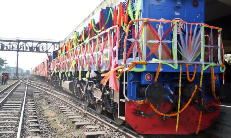 The first train of the Padma Bridge Rail Link Project (PBRLP) is pictured at Dhaka station, Dhaka, Bangladesh, Dec. 24, 2024. With the first train decorated with colorful ribbons arriving at Dhaka station, Bangladesh's largest railway Padma Bridge Rail Link Project (PBRLP) officially opened across its entire line to traffic here Tuesday.
The PBRLP, one of the significant projects under the Belt and Road Initiative (BRI) in Bangladesh, was built by the China Railway Group Limited (CREC) and funded by the Export-Import Bank of China.
The railway, known locally as the Dream Road, stretches approximately 170 km. Following its opening, travel time between the capital Dhaka and the southwestern city of Jashore will be reduced from the original 10 hours to just three hours. (Xinhua)