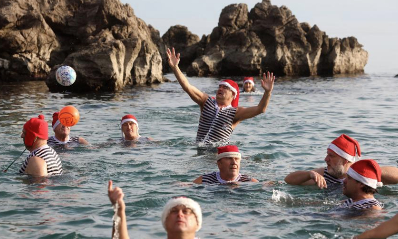 People take part in the traditional New Year's Day swimming in the sea in Opatija, Croatia, on Jan. 1, 2025. (Goran Kovacic/PIXSELL via Xinhua)
