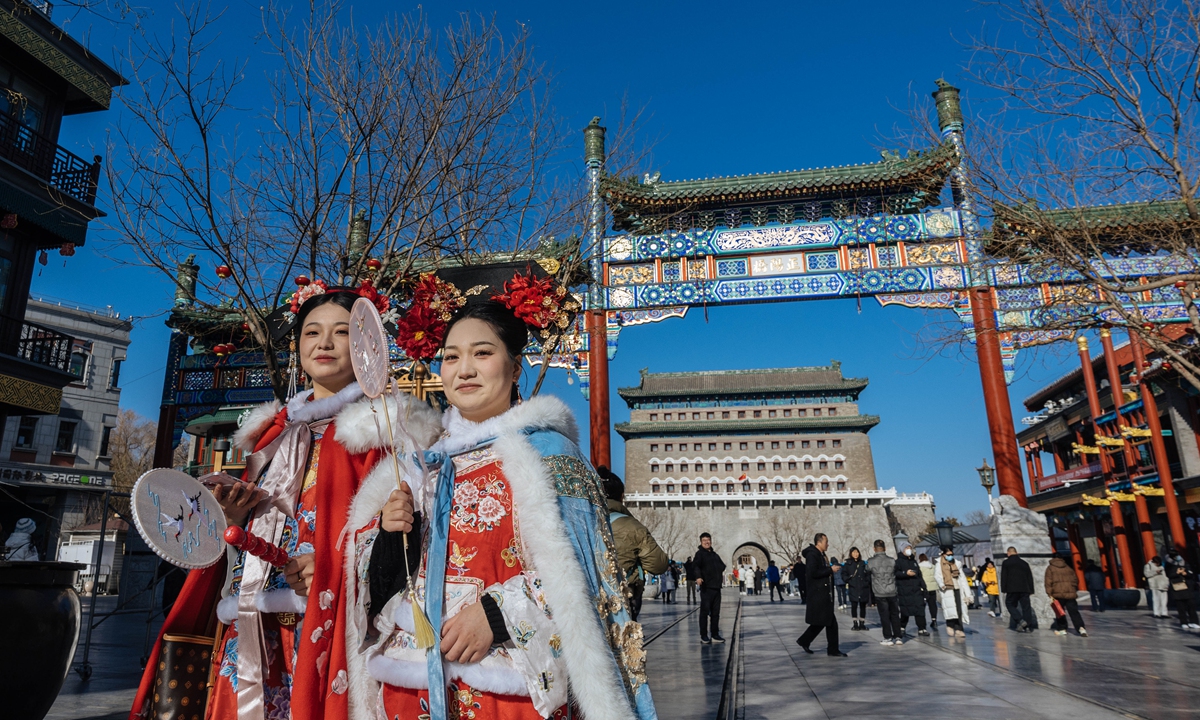 Tourists pass by the front of the Zhengyangmen Archery Tower in the center of Beijing on December 26, 2024. Dating back to the Ming Dynasty (1368-1644), the archery tower, located along Beijing's central axis, opened to the public on the day. Photo: Li Hao/GT
