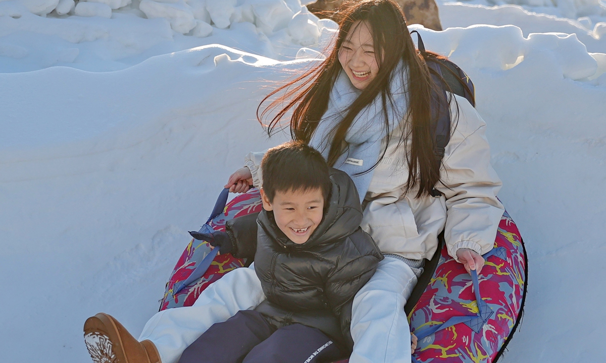 Tourists enjoy snow tubing at the Laojunding scenic area in Qinhuangdao, North China's Hebei Province on December 29, 2024. The area is diversifying itself as a winter tourist attraction in recent years, according to local media. Photo: VCG