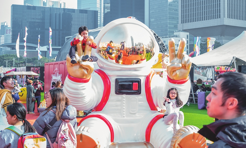 Residents and tourists in the Hong Kong Special Administrative Region celebrate the last weekend of 2024 by hanging out at Central Harbourfront Event Space on December 29, 2024. Photo: VCG