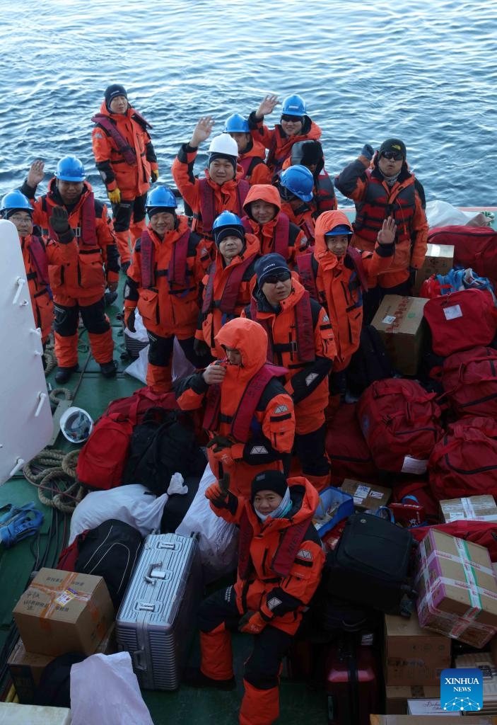 Members of China's 41st Antarctic expedition team are pictured on a barge while transporting supplies to China's Qinling Station in Antarctica on Dec. 25, 2024. Chinese research icebreaker Xuelong 2, or Snow Dragon 2, and cargo vessel Yong Sheng, which are on China's 41st Antarctic expedition, arrived at China's Qinling Station in Antarctica on Dec. 25 and carried out unloading operations. (Xinhua/Huang Taoming)