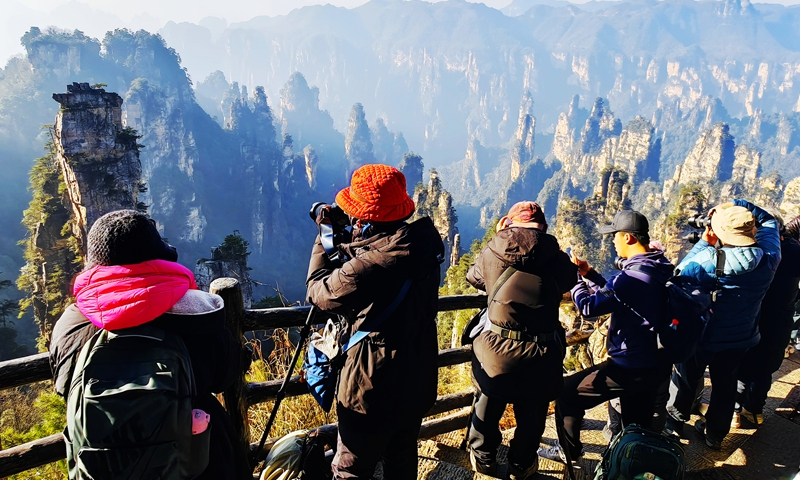 South Korean photographers take pictures in Zhangjiajie National Forest Park in Central China's Hunan Province on January 5, 2025. The tour comes as China's visa-free policy has sparked an inbound tourism boom from the globe, including South Korea. Photo: VCG