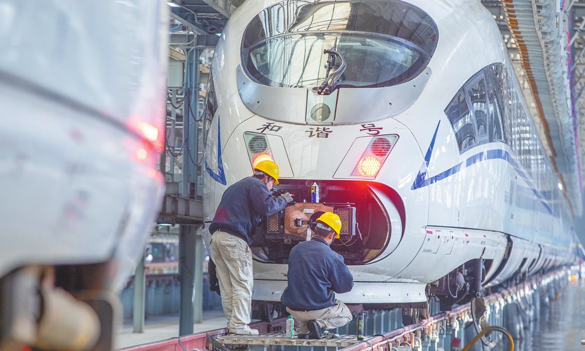 Mechanicians at China Railway Xi'an Group Co in Northwest China's Shaanxi Province check a bullet train to ensure its normal operating condition on January 6, 2025. The 40-day Spring Festival travel rush in 2025 will begin on January 14 and end on February 22, with the railway passenger volume expected to exceed 510 million passenger trips. Photo: cnsphoto
