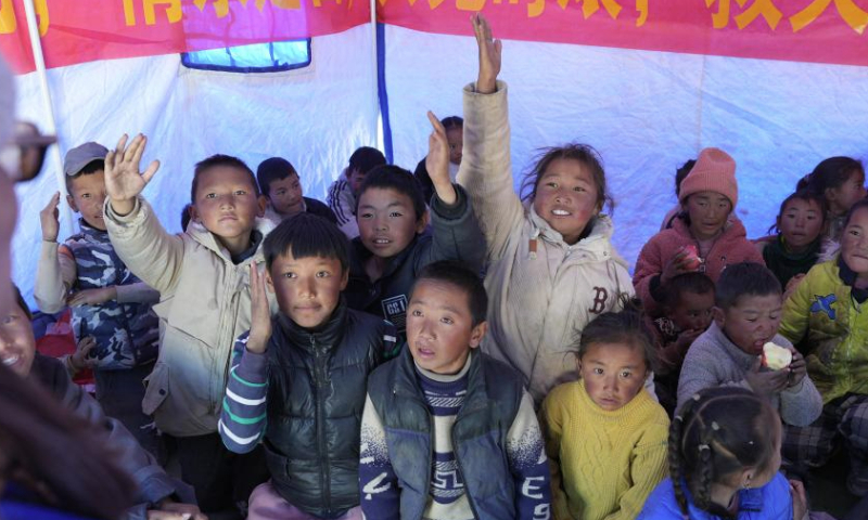 Children raise hands to answer questions during a psychology class given by a social work service center at a resettlement site of quake-affected residents in a village in Dingri County in Xigaze, southwest China's Xizang Autonomous Region, Jan. 8, 2025.
The search-and-rescue effort has entered its final stage after a 6.8-magnitude earthquake struck Dingri County in southwest China's Xizang Autonomous Region on Tuesday morning, the regional government said on Wednesday.
The focus of work has shifted to the resettlement of quake-affected residents and post-disaster reconstruction, said Hong Li, head of the regional emergency management department at a press conference. (Xinhua/Jigme Dorje)