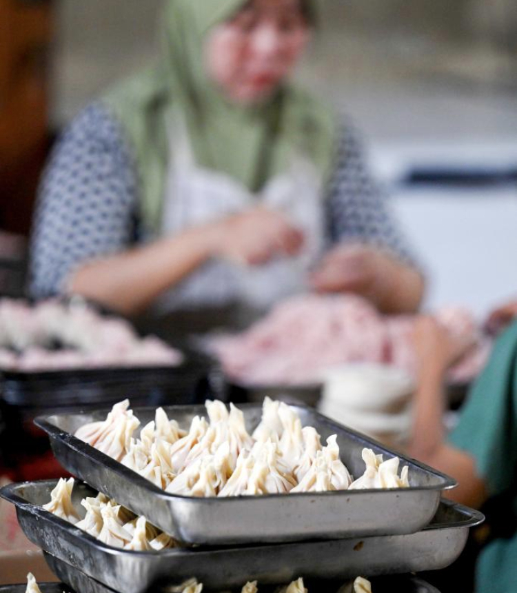 A worker makes dim sum at a workshop in South Tangerang, Banten Province, Indonesia, Jan. 14, 2025. The demand for dim sum and snacks has seen an increase in many regions of Indonesia as the Chinese New Year is around the corner. Food processing companies and workshops are stepping up production to meet the market demand. (Xinhua/Agung Kuncahya B.)