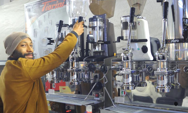 An exhibitor makes coffee for customers during a coffee exhibition called Spring of Coffee in Tunis, Tunisia on Jan. 11, 2025. The exhibition is open to the public from Jan. 8 to 12. (Photo by Adel Ezzine/Xinhua)