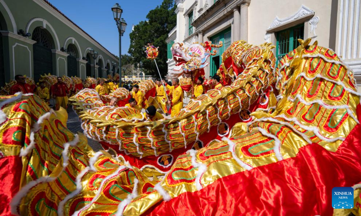 People perform dragon dance during a tour event in celebration of the Chinese New Year at the St. Augustine's Square in Macao, south China, Jan 29, 2025. Photo:Xinhua