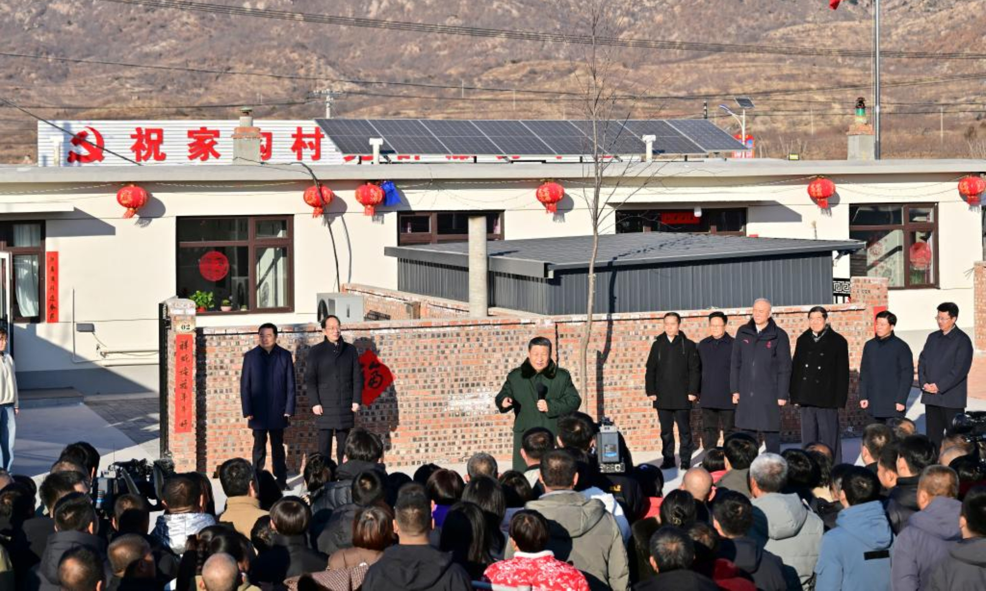 Chinese President Xi Jinping, also general secretary of the Communist Party of China Central Committee and chairman of the Central Military Commission, talks with villagers in Zhujiagou Village, Suizhong County of Huludao City, northeast China's Liaoning Province, Jan. 22, 2025. Xi braved the cold to visit people affected by floods in the village in northeast China's Liaoning Province. (Xinhua/Zhai Jianlan)