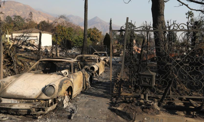 Cars destroyed by the blaze are seen in Altadena, Los Angeles County, California, the United States, on Jan. 10, 2025. Devastating wildfires continue to rage across different parts of Los Angeles County on Friday, leading to widespread disruptions, including school closures and the cancellation of entertainment, sports, and community events.

As of Friday, the wildfires have destroyed more than 12,300 structures and claimed at least 11 lives, with officials warning the true death toll will remain unclear until it is safe for investigators to go into neighborhoods. More than 100,000 people are under evacuation orders, with tens of thousands more under warnings. (Photo by Qiu Chen/Xinhua)