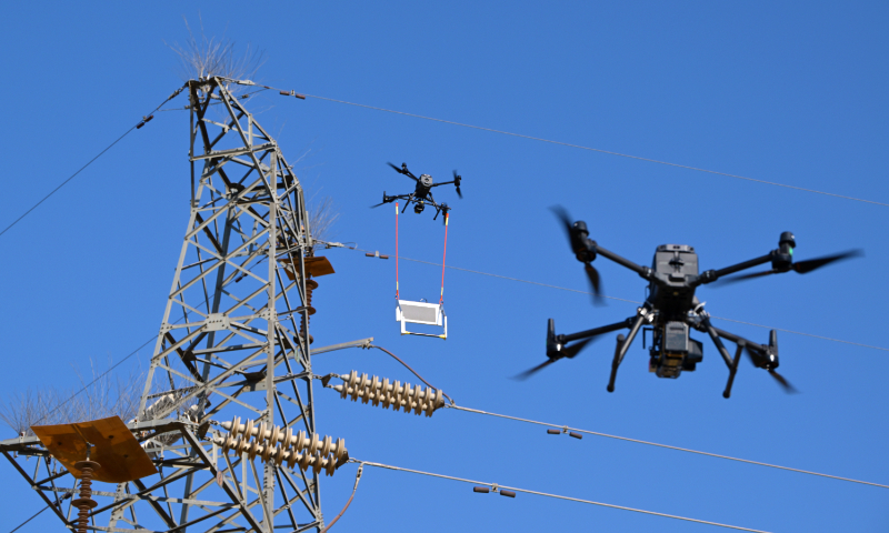 Drones look for flaws on transmission lines using X-rays to ensure the safety of the power grid in Yinchuan, Northwest China's Ningxia Hui Autonomous Region, on January 9, 2025. Workers can get real-time inspection photos from drone controllers to quickly determine whether there are internal defects in the power lines. Photo: VCG