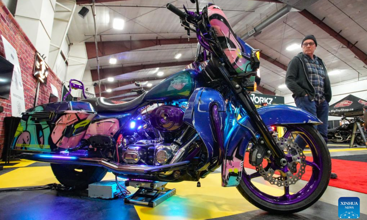 A man views a customized motorcycle during the Vancouver Motorcycle and Powersport Show in Abbotsford, British Columbia, Canada, Jan. 17, 2025. The three-day event kicked off here on Friday. (Photo: Xinhua)