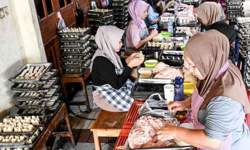 Workers make dim sum at a workshop in South Tangerang, Banten Province, Indonesia, Jan. 14, 2025. The demand for dim sum and snacks has seen an increase in many regions of Indonesia as the Chinese New Year is around the corner. Food processing companies and workshops are stepping up production to meet the market demand. (Xinhua/Agung Kuncahya B.)