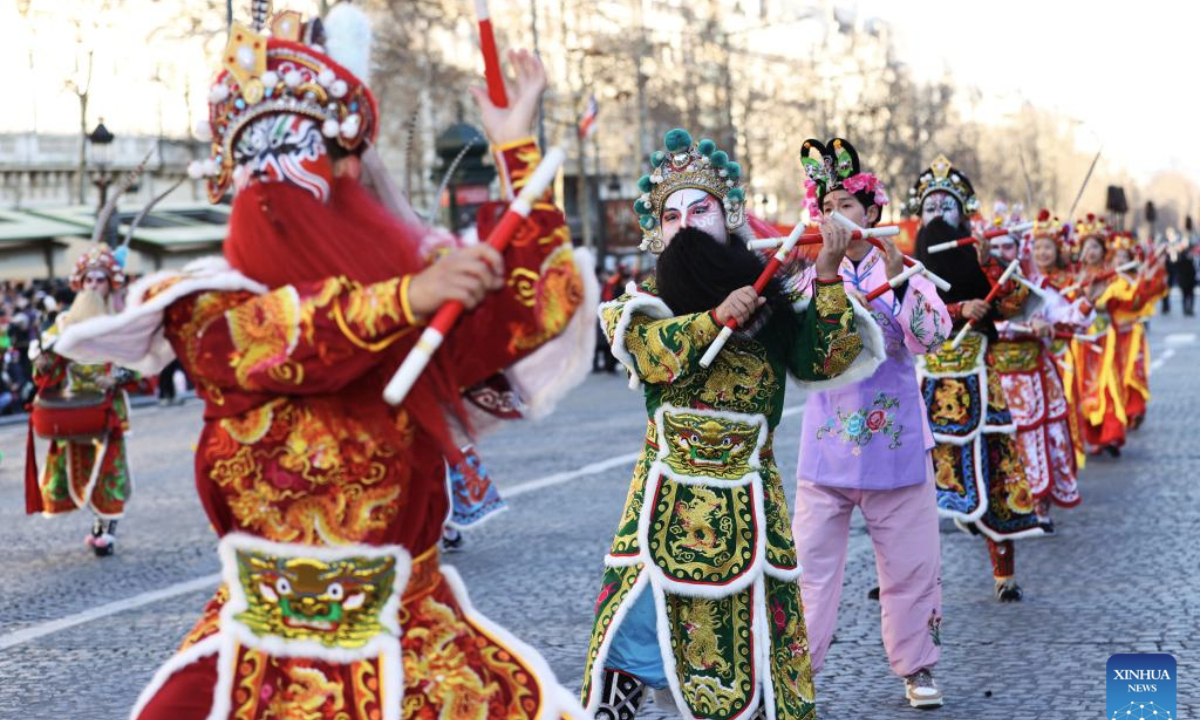 Members of a Yingge team perform Chaoyang Yingge dance during the Spring Festival celebration on the Champs-Elysees avenue in Paris, France, Feb. 2, 2025.
The Yingge dance, or dance to the hero's song, is a form of folk dance popular in south China's Guangdong Province and it was listed as the first batch of China's national intangible cultural heritage in 2006. (Xinhua/Gao Jing)