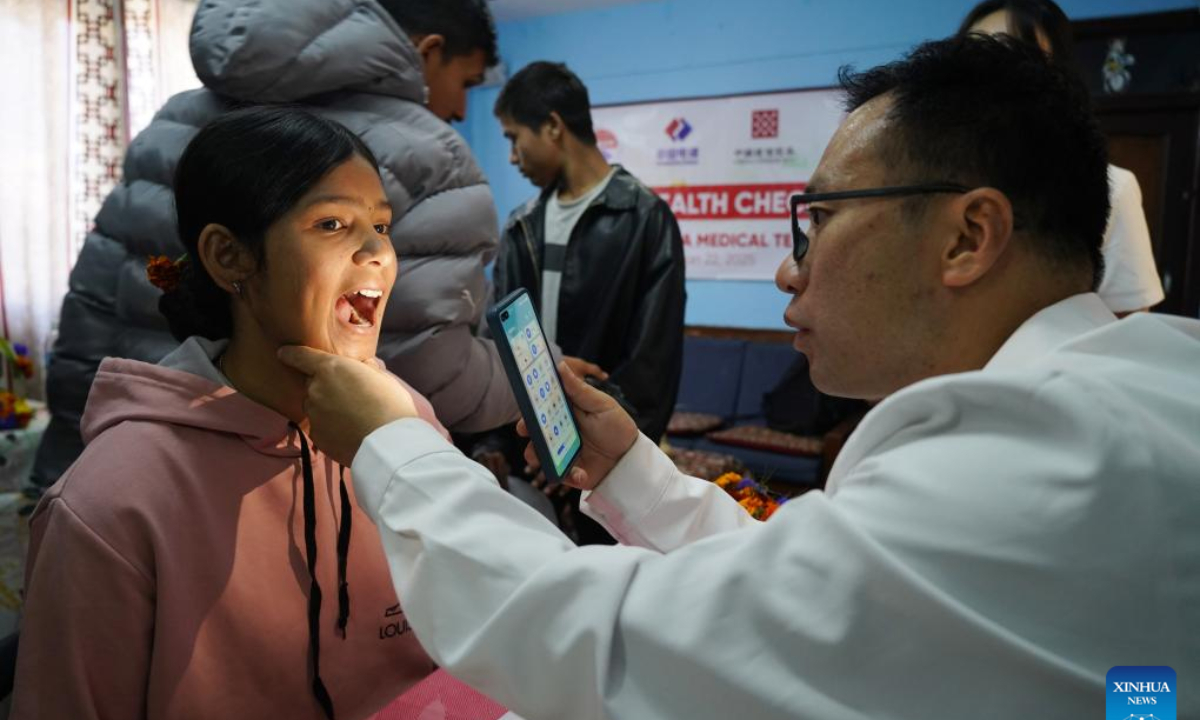 A doctor from a Chinese medical team provides a free health check-up for an orphan at Prayas Nepal, a non-profit and non-governmental organization, in Kathmandu, Nepal, Jan. 22, 2025. Doctors from a Chinese medical team in Nepal provided free health check-ups for some orphans in Kathmandu, the country's capital, on Wednesday. (Photo by Hari Maharjan/Xinhua)