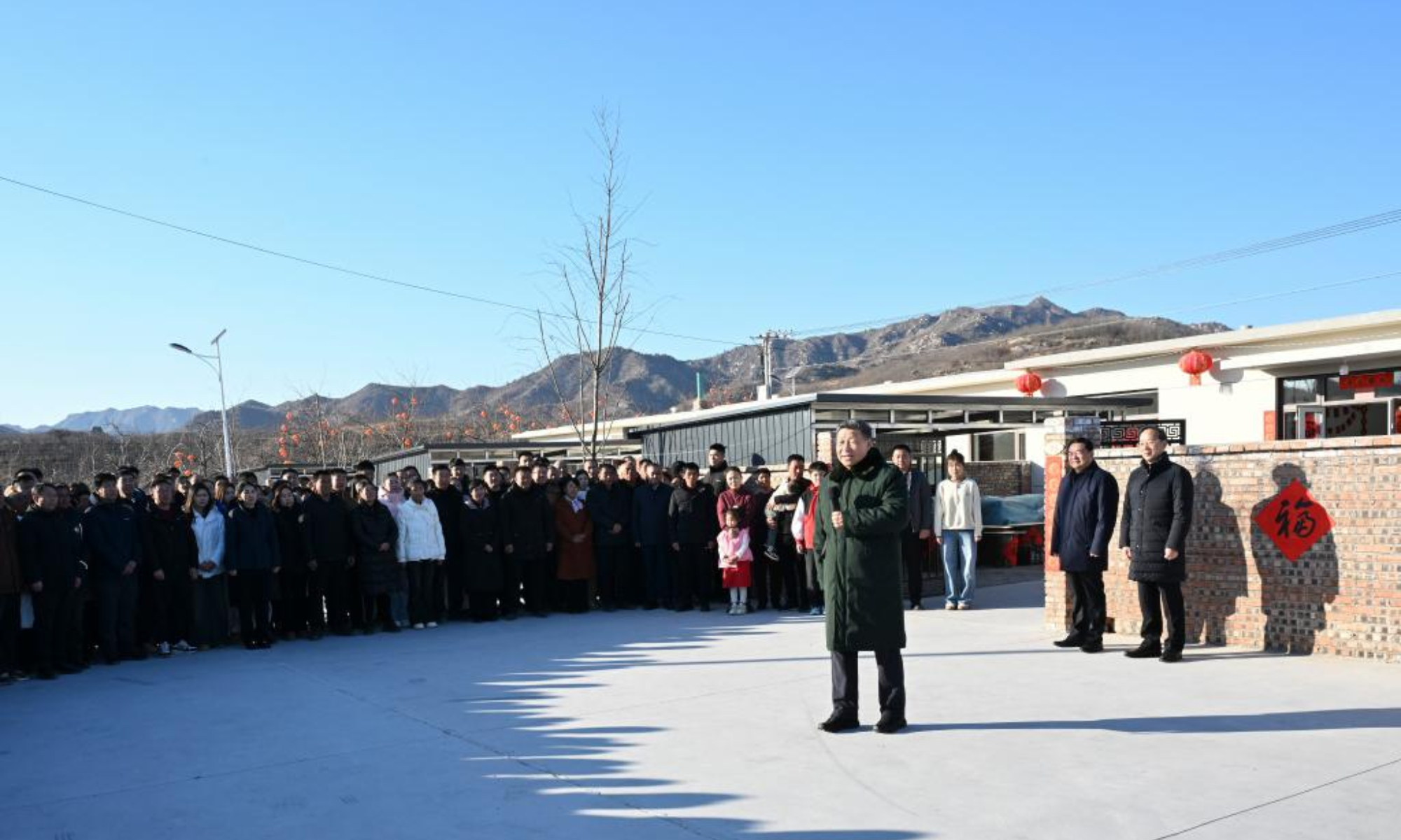 Chinese President Xi Jinping, also general secretary of the Communist Party of China Central Committee and chairman of the Central Military Commission, talks with villagers in Zhujiagou Village, Suizhong County of Huludao City, northeast China's Liaoning Province, Jan. 22, 2025. Xi braved the cold to visit people affected by floods in the village in northeast China's Liaoning Province. (Xinhua/Xie Huanchi)