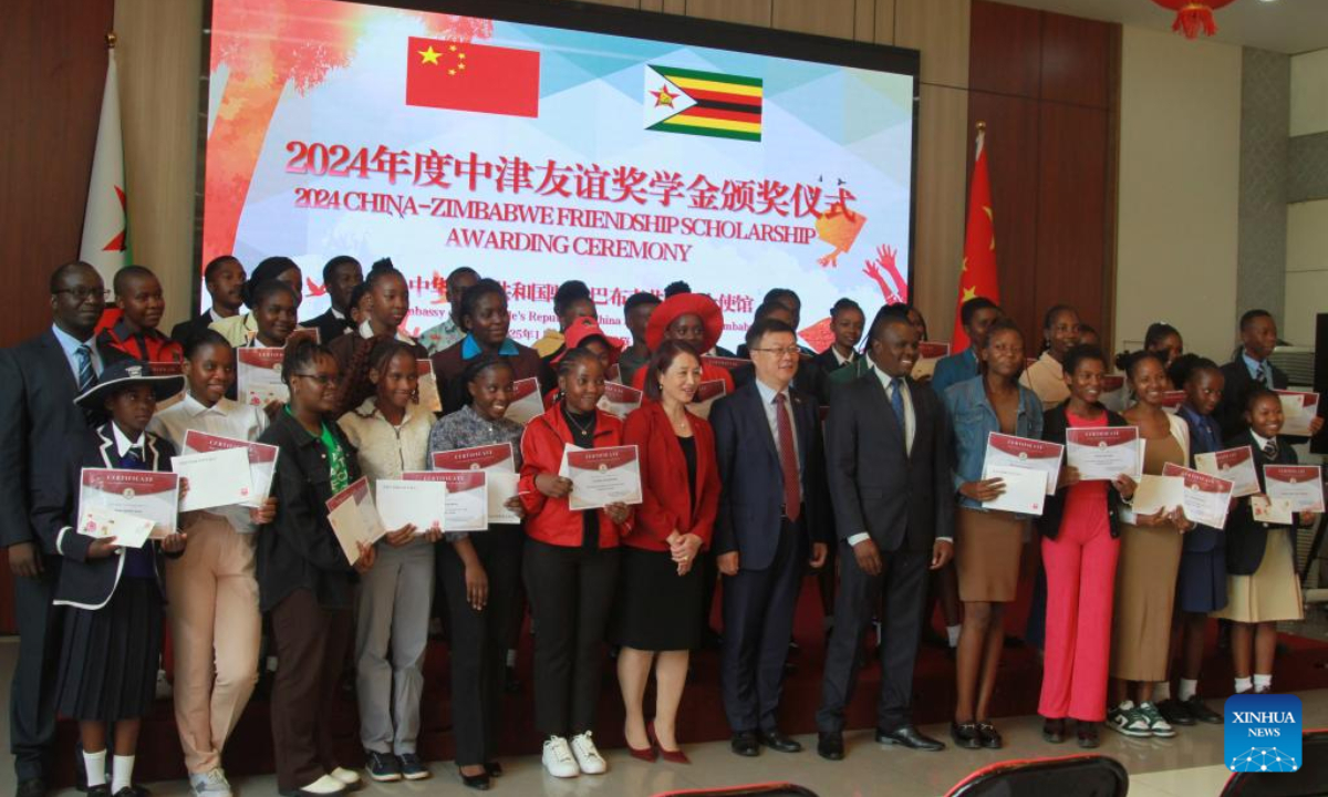 Participants pose for a group photo during the China-Zimbabwe Friendship Scholarship awarding ceremony at the Chinese embassy in Harare, Zimbabwe, on Jan. 21, 2025. A total of 52 Chinese language learners in Zimbabwe on Tuesday received scholarships under the China-Zimbabwe Friendship Scholarship program for academic excellence. (Xinhua/Tafara Mugwara)