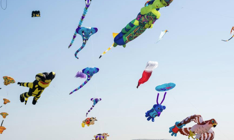 Kites fly in the sky during the Qatar Kite Festival 2025 at Old Doha Port in Doha, Qatar, Jan. 19, 2025. (Photo by Nikku/Xinhua)