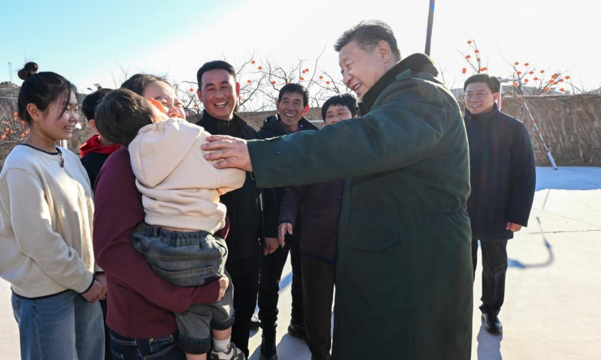 Chinese President Xi Jinping, also general secretary of the Communist Party of China Central Committee and chairman of the Central Military Commission, talks with villagers in Zhujiagou Village, Suizhong County of Huludao City, northeast China's Liaoning Province, Jan. 22, 2025. Xi braved the cold to visit people affected by floods in the village in northeast China's Liaoning Province. (Xinhua/Xie Huanchi)