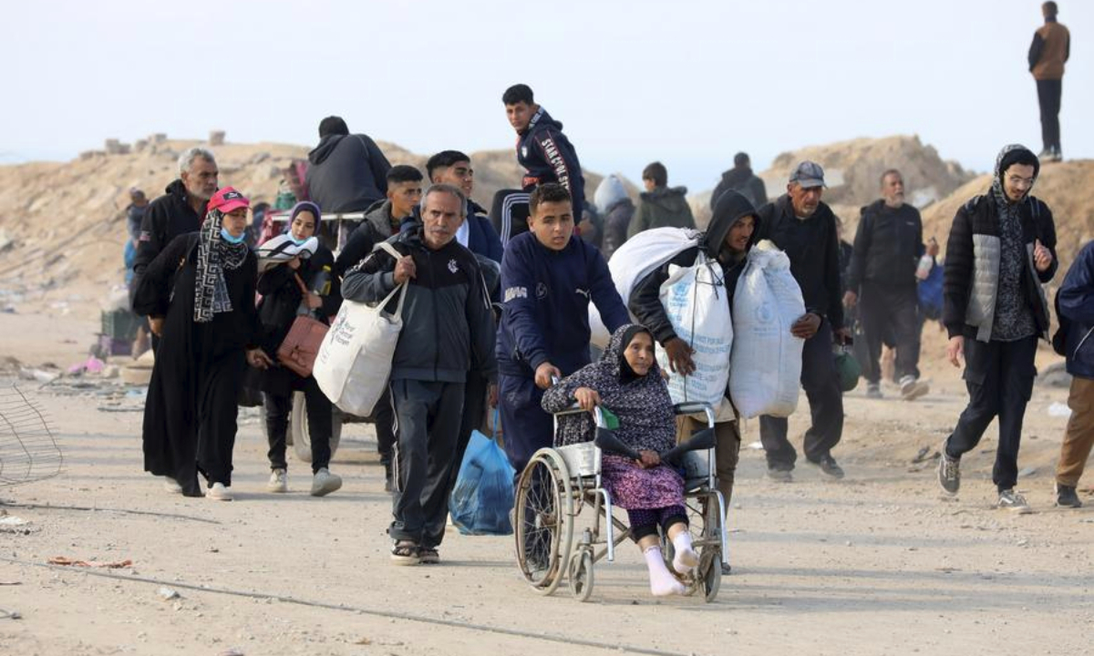 Displaced people are seen on their way home to the north of the Gaza Strip, near al-Nuseirat refugee camp in central Gaza Strip, on Jan. 28, 2025. (Photo by Rizek Abdeljawad/Xinhua)