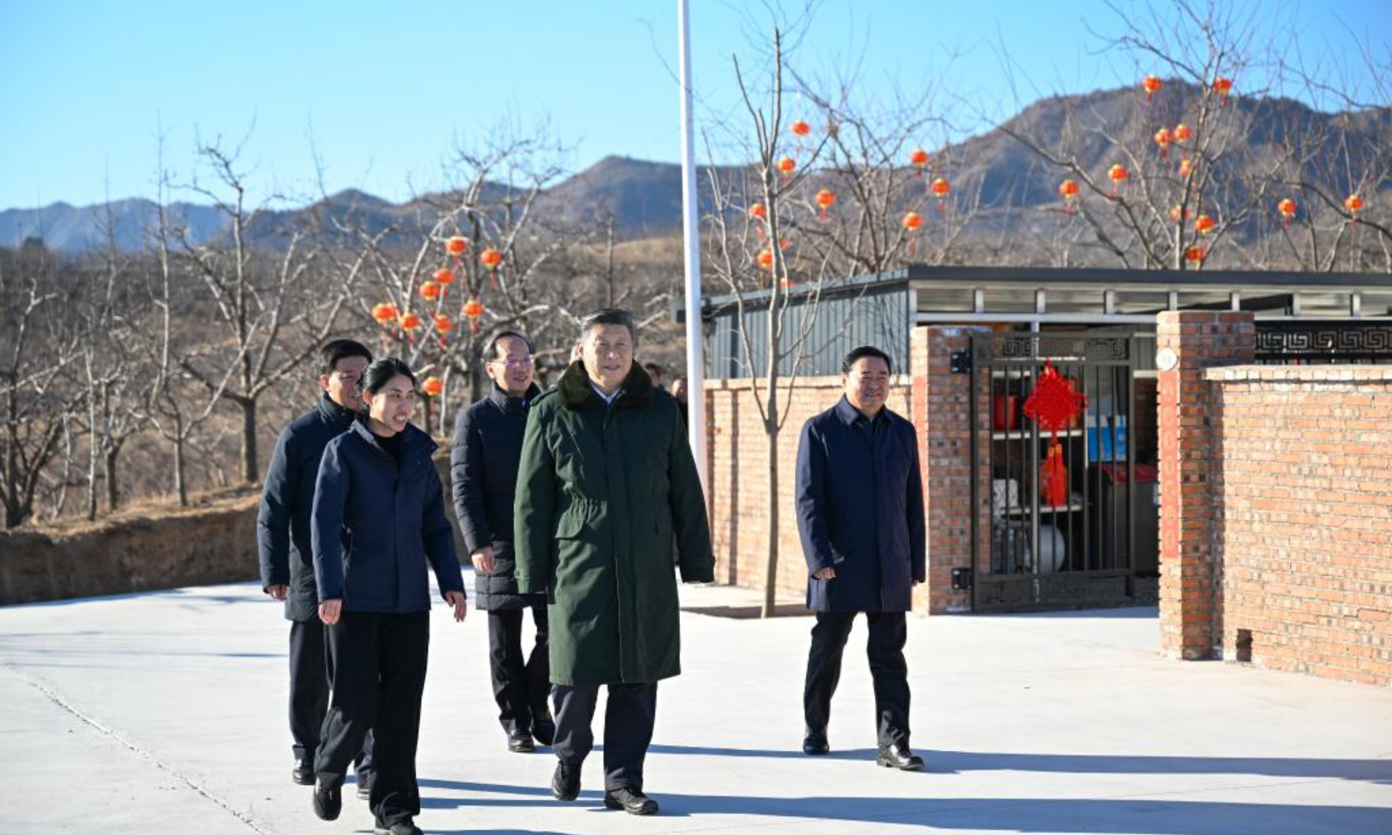 Chinese President Xi Jinping, also general secretary of the Communist Party of China Central Committee and chairman of the Central Military Commission, inspects the progress in post-disaster restoration and reconstruction, in Zhujiagou Village, Suizhong County of Huludao City, northeast China's Liaoning Province, Jan. 22, 2025. Xi braved the cold to visit people affected by floods in the village in northeast China's Liaoning Province. (Xinhua/Xie Huanchi)