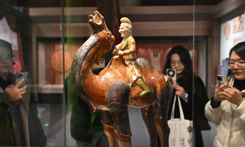 Visitors take photos of a tri-colored glazed pottery work, which depicts a nomadic camel rider, at National Maritime Museum of China in north China's Tianjin, Jan. 15, 2025. An exhibition featuring the highlights of Tang Dynasty (618-907 AD) cultural relics in Shaanxi Province kicked off at National Maritime Museum of China in Tianjin on Wednesday.

The exhibition brings together about 120 pieces (sets) of cultural relics from eight cultural institutions across Shaanxi Province. (Xinhua/Sun Fanyue)