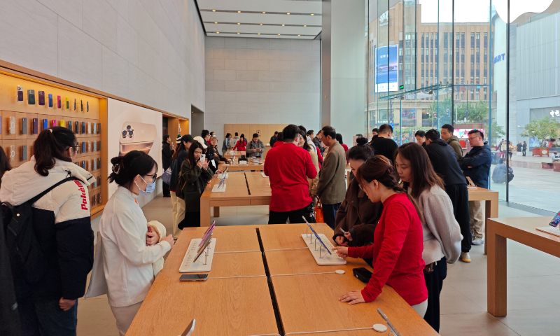Customers are seen at an Apple store in Shanghai on November 20, 2024. Photo: VCG