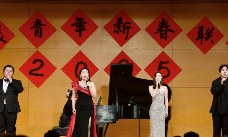 Chinese and U.S. performers jointly present the song Lights of China during the 2025 Spring Festival Gala for Chinese and American Youths at the Chinese Embassy in Washington, D.C., the United States, Jan. 11, 2025. The Chinese Embassy in the United States recently hosted the 2025 Spring Festival Gala for Chinese and American Youths, with over 500 young students from both countries and members of the American education community in attendance. (Xinhua/Deng Xianlai)

