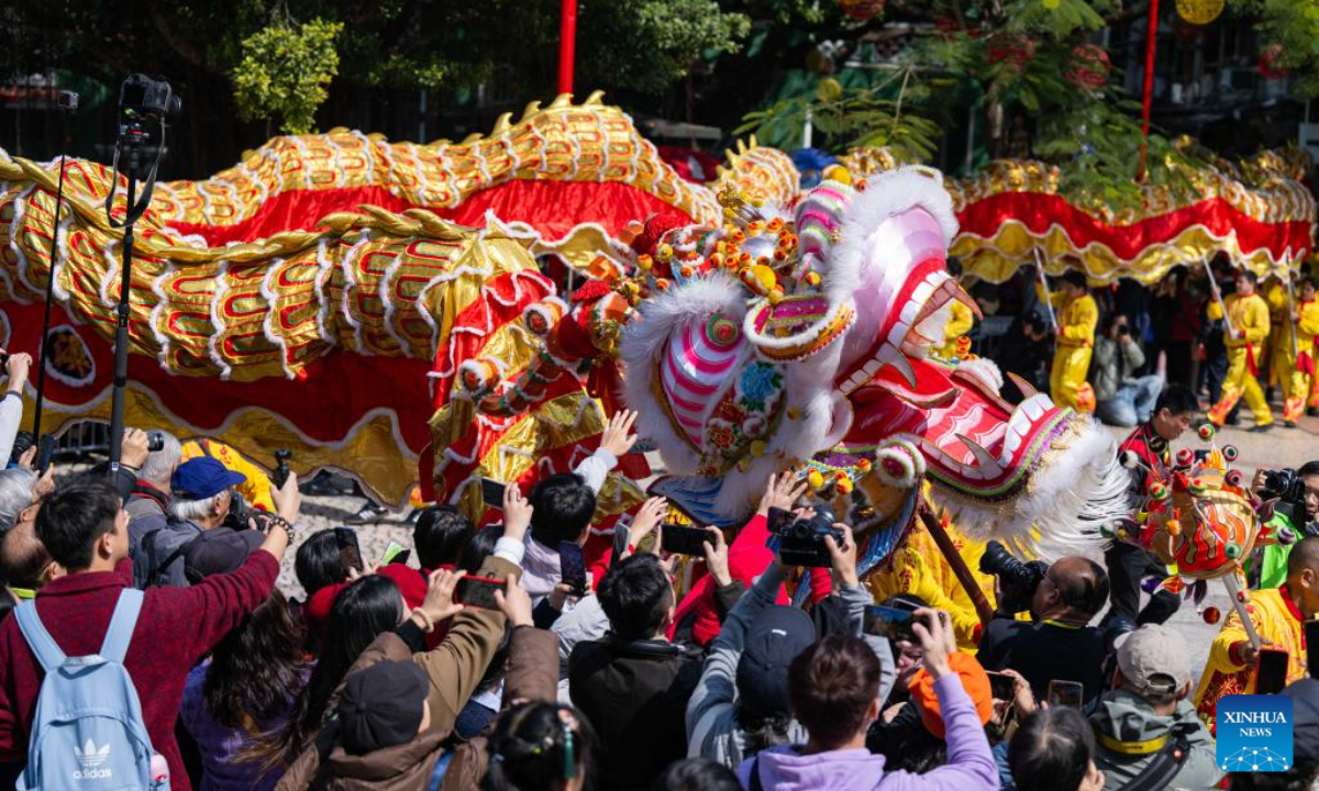 People perform dragon dance during a tour event in celebration of the Chinese New Year in front of the A-Ma Temple in Macao, south China, Jan 29, 2025. Photo:Xinhua