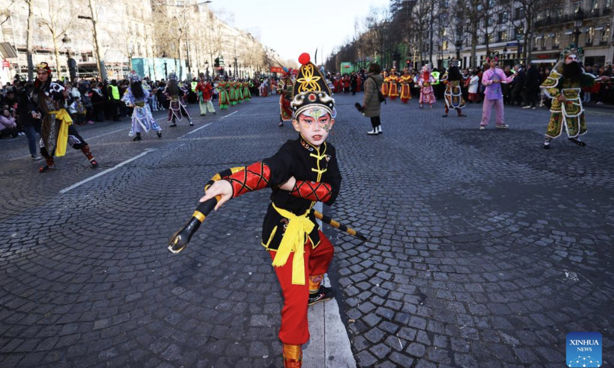 Members of a Yingge team perform Chaoyang Yingge dance during the Spring Festival celebration on the Champs-Elysees avenue in Paris, France, Feb. 2, 2025.
The Yingge dance, or dance to the hero's song, is a form of folk dance popular in south China's Guangdong Province and it was listed as the first batch of China's national intangible cultural heritage in 2006. (Xinhua/Gao Jing)