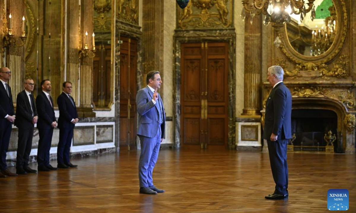 Bart De Wever (C) is sworn in as Belgium's prime minister at the Royal Palace in Brussels, Belgium, Feb. 3, 2025.

Belgium's new government was sworn in on Monday, ending months of a political deadlock over forming a stable coalition government. (Belga News Agency via Xinhua)

