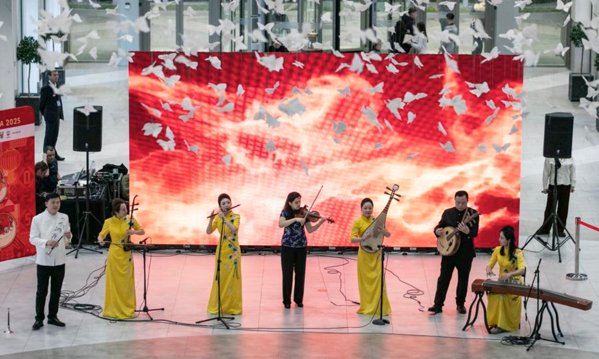 Artists from the Hubei Performing Arts Group play traditional Chinese instruments during Charming Hubei flash mob in Belgrade, Serbia, Feb. 8, 2025. The Arts Group brought a vibrant showcase of Chinese folk arts to Belgrade, on Saturday evening with a flash performance at Galerija Shopping Mall, as part of Serbia's Spring Festival celebrations. (Photo by Wang Wei/Xinhua)