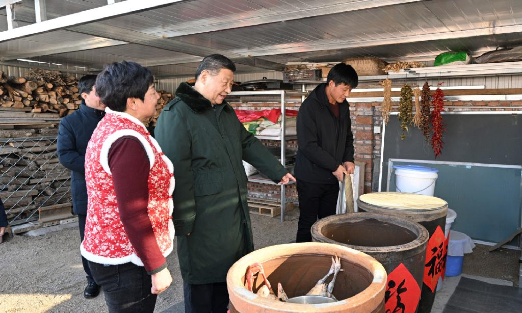 Chinese President Xi Jinping, also general secretary of the Communist Party of China Central Committee and chairman of the Central Military Commission, visits the villagers who have moved into their new houses and inquires about the quality of the reconstructed homes and whether their daily living conditions are adequate, in Zhujiagou Village, Suizhong County of Huludao City, northeast China's Liaoning Province, Jan. 22, 2025. Xi braved the cold to visit people affected by floods in the village in northeast China's Liaoning Province. (Xinhua/Li Xueren)