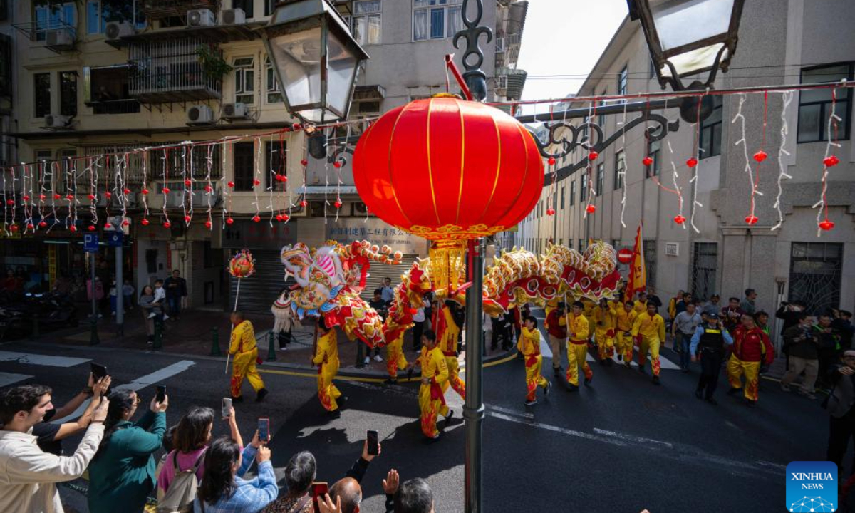 People perform dragon dance during a tour event in celebration of the Chinese New Year at the St. Lawrence Parish in Macao, south China, Jan 29, 2025. Photo:Xinhua