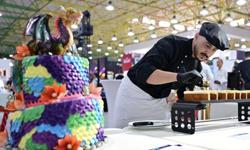 A cook prepares dessert during the HORECA Kuwait 2025 exhibition in Hawalli Governorate, Kuwait, Jan. 14, 2025.

The exhibition was launched here on Tuesday to promote food service and tourism industry. (Photo by Asad/Xinhua)