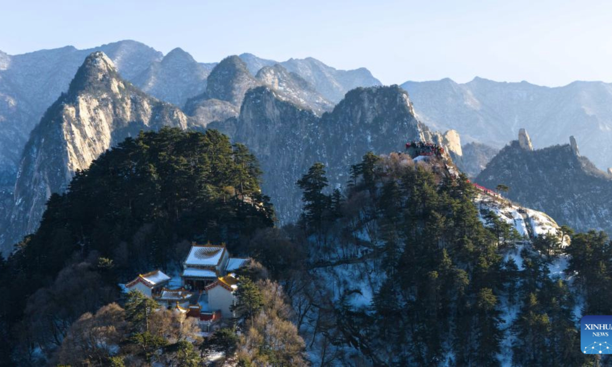 This aerial drone photo taken on Feb. 3, 2025 shows the scenery of Huashan Mountain in Weinan City, northwest China's Shaanxi Province. Huashan Mountain ushered in peak tourist season during the Spring Festival holiday with the average number of daily visitors exceeding 20,000. (Xinhua/Zou Jingyi)