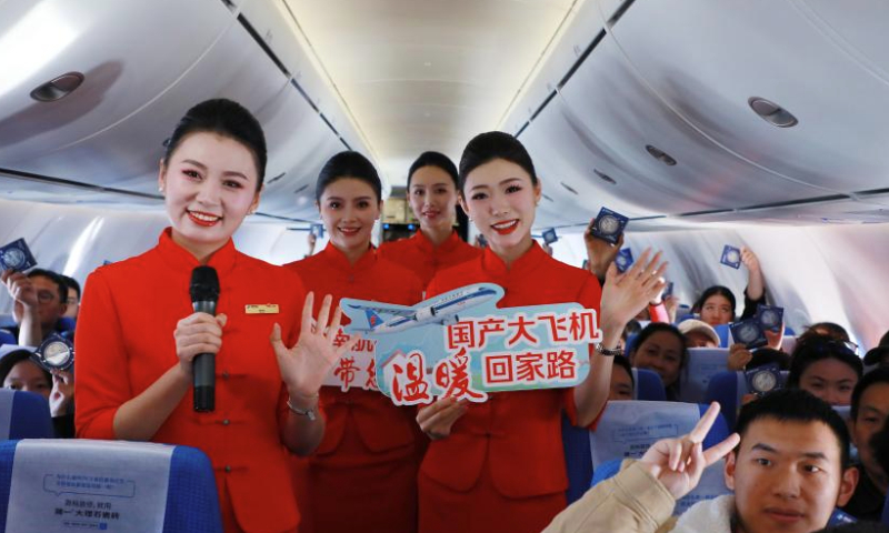 Flight attendants and passengers are pictured during a themed activity aboard a C919 passenger jet carrying out a flight from Guangzhou to Chengdu, on Jan. 14, 2025.

The China Southern Airlines held a themed activity aboard the C919 aircraft on Tuesday to mark the deployment of the passenger jets for this year's Spring Festival travel rush (also known as chunyun).
All three C919 jets operated by China Southern were deployed on Tuesday, the first day of this year's chunyun, to carry out 10 flights on four routes linking Guangzhou with the cities of Hangzhou, Shanghai, Haikou and Chengdu.
This year's chunyun sees an increased appearance of the home-grown C919 aircraft, a symbol of China's technological and industrial advancement. (Xinhua/Wang Ruiping)