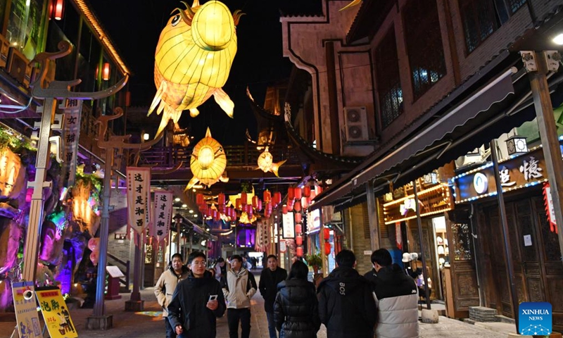 Tourists visit a scenic spot noted for its splendid building in Zhangjiajie, central China's Hunan Province, on Jan. 9, 2025.