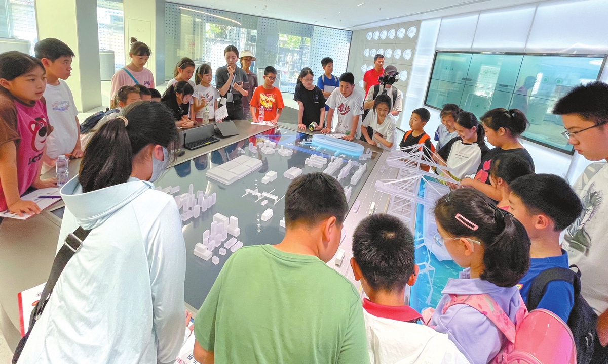 Migrant children in Shanghai's Jiangsu Road subdistrict visit a local tech company, on July 18, 2024. Photo: Courtesy of the subdistrict