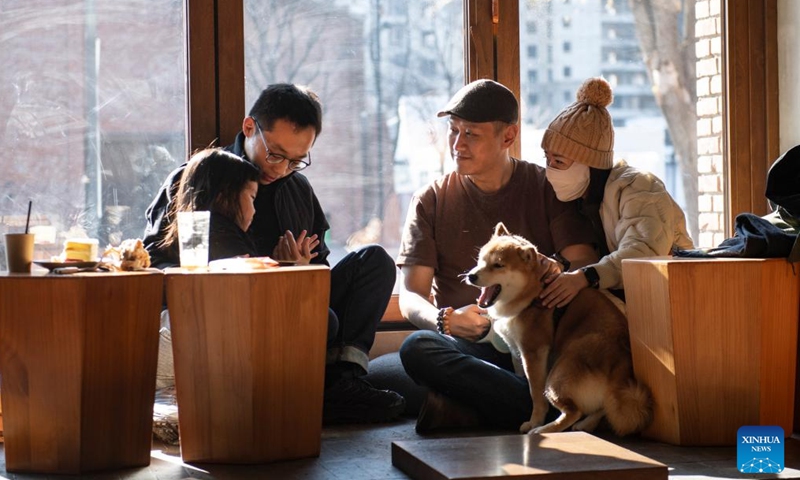 Visitors spend their leisure time at a coffee shop in the Hongmei cultural and creative industry park, which is transformed from an old factory, in Tiexi District of Shenyang, capital of northeast China's Liaoning Province, Nov. 30, 2024. (Xinhua/Sun Ruibo)