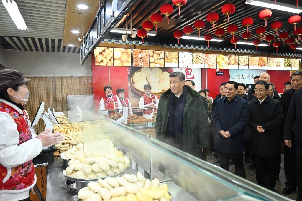 Chinese President Xi Jinping, also general secretary of the Communist Party of China Central Committee and chairman of the Central Military Commission, learns about the supply of goods during the holiday season and measures in place to meet residents' daily needs while visiting a food market in Shenyang, capital city of northeast China's Liaoning Province, Jan. 23, 2025. Xi on Thursday inspected Shenyang.
