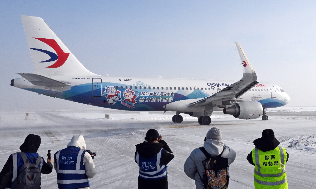 A plane decorated with Asian Winter Games elements prepares to take off at the newly constructed east second runway of Harbin Taiping International Airport, North China's Heilongjiang Province on January 23, 2025. The new runway was put into operation on the day to improve services for the upcoming Asian Winter Games. Photo: VCG