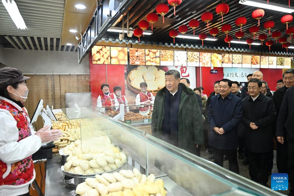 Chinese President Xi Jinping, also general secretary of the Communist Party of China Central Committee and chairman of the Central Military Commission, learns about the supply of goods during the holiday season and measures in place to meet residents' daily needs while visiting a food market in Shenyang, capital city of northeast China's Liaoning Province, Jan. 23, 2025. Xi on Thursday inspected Shenyang. (Xinhua/Xie Huanchi)