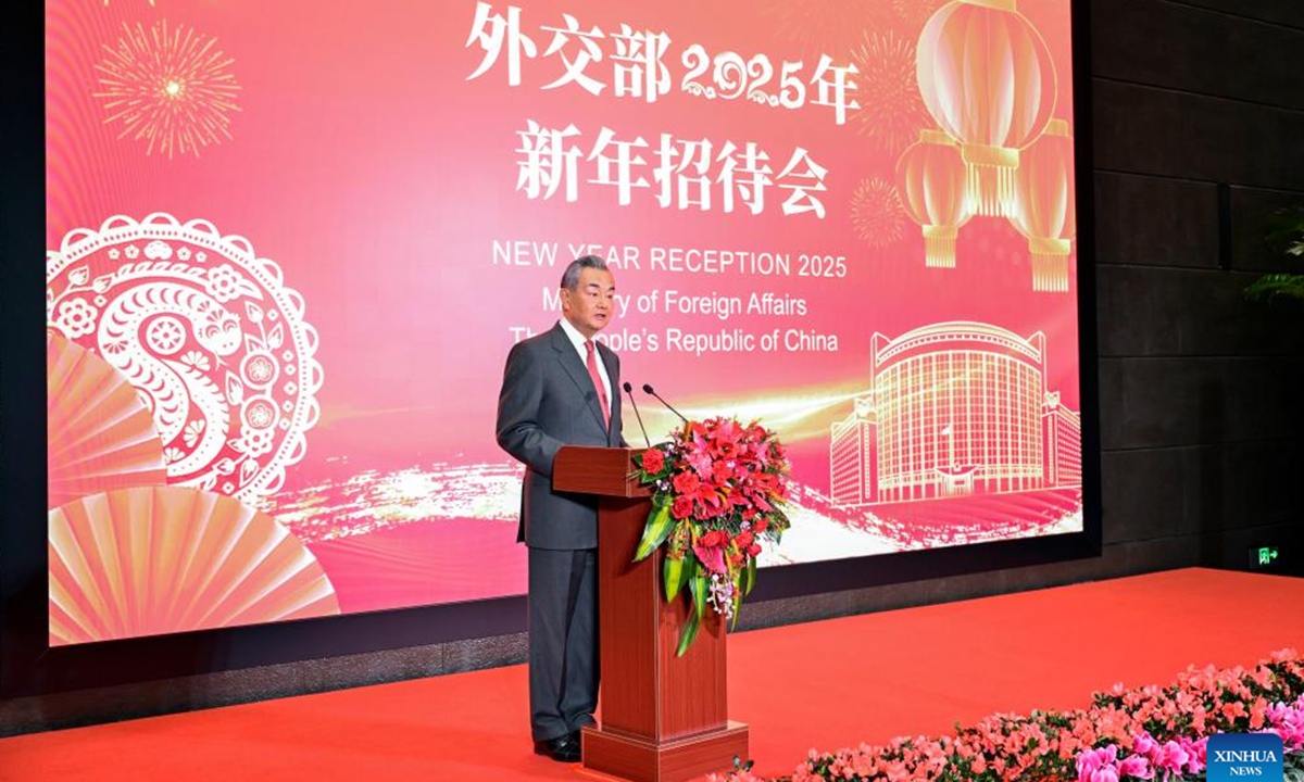 Chinese Foreign Minister Wang Yi, also a member of the Political Bureau of the Communist Party of China Central Committee, hosts the Chinese Foreign Ministry's 2025 New Year reception at the Beijing Performing Arts Center in Beijing, capital of China, Jan. 24, 2025. (Xinhua/Yin Bogu)