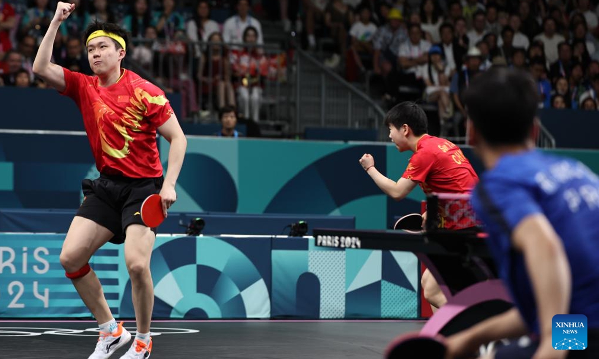 Wang Chuqin (L)/Sun Yingsha of China react during the mixed doubles gold medal table tennis match between Wang Chuqin/Sun Yingsha of China and Ri Jong Sik/Kim Kum Yong of the Democratic People's Republic of Korea at the Paris 2024 Olympic Games in Paris, France, on July 30, 2024.(File Photo:Xinhua)